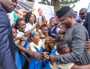 Ag President Yemi Osinbajo with school children