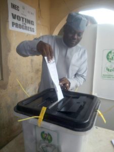 Former Speaker of the Osun state House of Assembly Hon Adejare Bello a member of the Peoples Democratic Party PDP casting his vote in Ede at ward 3 Unit 4 Olagunju Agba Akin at about 925am