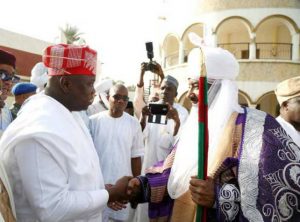 Lagos State Governor Mr Akinwunmi Ambode left exchanging pleasantries with the Emir of Kano Alhaji Sanusi Lamido right during the introduction ceremony of Abolaji Ajimobi and Fatima Ganduje in Kano on Friday November 10 2017