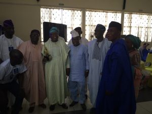 Right, Mr Akin Aregbesola and others after Comrade Awa Bamiji, left, with his group gave an award to the celebrant...