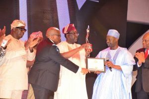 Steve Ayorinde receives Governor Akinwunmi Ambode's award as Governor of the Year...