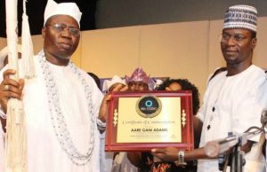 Aare Gani Adams being given an award at the event