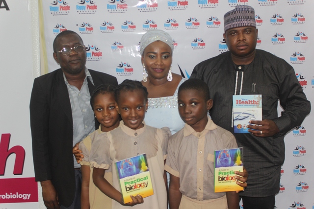 From right The author's husband, Engr. Babatunde Azeez, the author and master and students of Montessori Nursery and Primary School