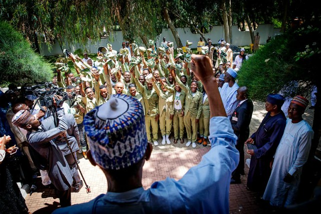 President Muhammadu Buhari attending to NYSC Members who visited him in his home