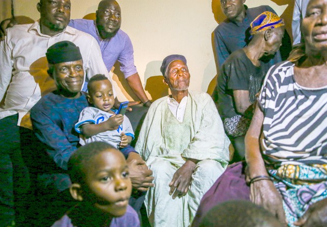 Vice President Yemi Osinbajowith a familyin Abuja during the'Family Chat' tour...