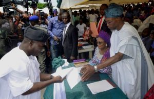 At Last, Aregbesola Inaugurates Cabinet, Check Portfolios, Exclusive Pix ...Gov Aregbesola with Mr Adelani Baderinwa, the new Commissioner for Information...