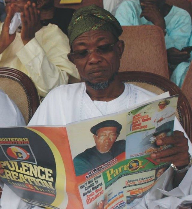 ...workaholic and rapacious reader...Gov Rauf Aregbesola...going though our sister publication, Parrot Xtra Magazine...