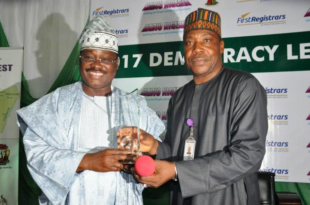 Zonal Director, Radio Nigeria Ibadan Network Centre, Mr Muhammed Bello (right), presenting an Award to Oyo State Governor, Senator Abiola Ajimobi