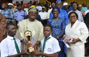 Nostalgia As Ajimobi Presents Trophy To Lagelu Grammar School, His Alma Mater On Children’s Day L-R: Oyo State Governor, Senator Abiola Ajimobi (second row) presents trophy of first position to Lagelu Grammar School, Ibadan; Commissioner for Women Affairs, Social Development and Poverty Alleviation, Mrs Atinuke Oshunkoya; and the ministry's Permanent Secretary, Mrs Folusho Sali, at this year's Children day march past held at the Lekan Salami Stadium, Ibadan...on Saturday