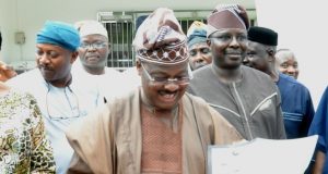 Ajimobi Takes Time To Speak About His Government’s Education Policy Governor Abiola Ajimobi...going through one of the editions of our sister publication, Parrot Xtra Magazine...to his left is Prof Adeniyi Olowofela, his Commissioner for Education...