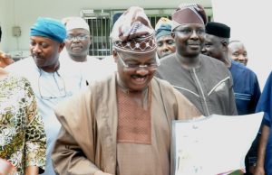 Ajimobi Takes Time To Speak About His Government’s Education Policy Governor Abiola Ajimobi...going through one of the editions of our sister publication, Parrot Xtra Magazine...to his left is Prof Adeniyi Olowofela, his Commissioner for Education...