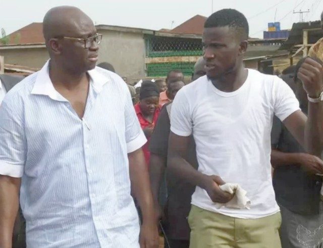 ...Governor Ayodele Fayose with an NYSC member during a recent encounter...