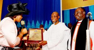 Photo: Aregbesola Honoured At Anglican Synod, Otan-Ayegbaju Governor State of Osun, Ogbeni Rauf Aregbesola (middle) receiving a plaque from wife of the Bishop Osun North East Anglican Diocese, Professor (Mrs) Motunrayo Olumakaiye and Bishop Humphrey Olumakaiye, during the event…