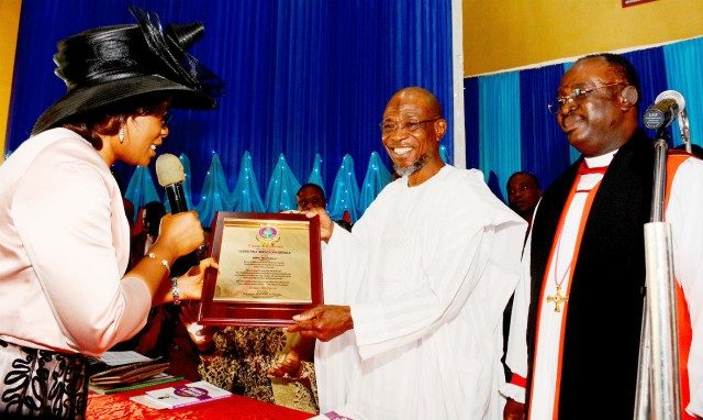 Governor State of Osun, Ogbeni Rauf Aregbesola (middle) receiving a plaque from wife of the Bishop Osun North East Anglican Diocese, Professor (Mrs) Motunrayo Olumakaiye and Bishop Humphrey Olumakaiye, during the event…