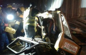 Tragedy In Lagos: Container Falls On Two Fully Loaded Buses ...one of the buses with a body of one of the victims hanging...