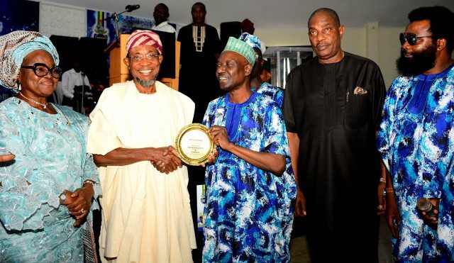 The National Chairman, Police Community Relations Committee (PCRC), Dr Faruk Maiyama (3rd right) presenting a plaque to the Governor of Osun, Ogbeni Rauf Aregbesola as the Grand Patron PCRC. With them are, Deputy NationalChairman PCRC South West, Mrs Adebola Adebutu (left); Former Inspector-General of Police, Dr Solomon Arase (2nd right) and Chairman Osun PCRC, Comrade Amitolu Shittu, at the event held at Atlantis Event Centre, Osogbo…
