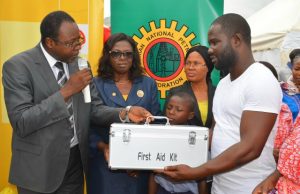 Jubilation In Abuja As SNEPCo Launches Health Crusade Shell’s Regional Community Health Manager, Dr. Akinwunmi Fajola, (left) presenting a First Aid box to one of the beneficiaries of the SNEPCo Health-in-Motion programme held in Gidan Mangoro community of Karu in Abuja…