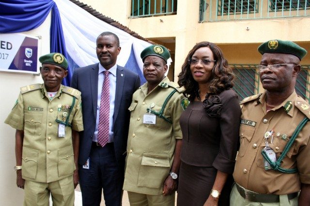 R-L: Executive Director, Investments, Mr. Oladele Sotubo; Head, Business Development, Mrs. Nike Bajomo, both of Stanbic IBTC Pension Managers Limited (SIPML), handing over the keys to newly renovated blocks of sanitary facilities by SIPML at the Nigerian Prisons Services (NPS) Training College Kaduna to Commandant Prisons Staff College Kaduna, Asst. Controller General, Kehinde Fadipe; Commandant Prisons Training School Kaduna, Controller of Prisons, Patrick Ani; and Zonal Coordinator Zone B, Nigerian Prisons Service, Asst. Controller General, Musa Maiyaki, during the handing over ceremony and commissioning…