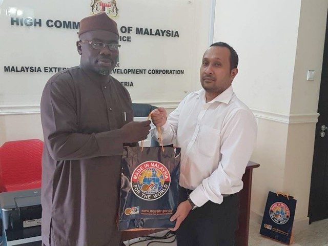The Ag. Director-General of DAWN Commission, Seye Oyeleye, left, during the visit to the Malaysian Trade Commissioner to Nigeria, Mhod Khairy…