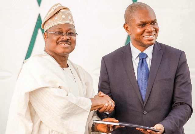 L-R: Oyo State Governor, Senator Abiola Ajimobi, receiving the Industrial Policy document from the United Nations Industrial Development Organisation's (UNIDO) Representative to ECOWAS and Regional Director, Nigeria Regional Office Hub, Mr. Jean Bakole, at the Governor’s Office, Ibadan...over the weekend…