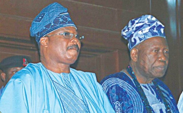Governor Abiola Ajimobi of Oyo State, left, with the Olubadan of Ibadanland, Oba Saliu Adetunji...who 'whispers' first?
