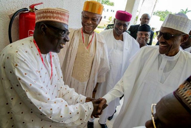 President Muhammadu Buhari meets PDP's Chairman, Ahmed Makarfi while Chief John Odigie Oyegun and others look on...