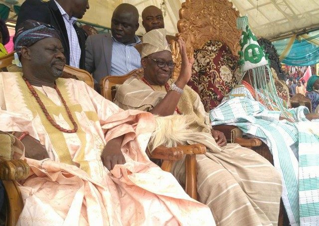 Governor Ayodele Fayose, middle, with Oba Rufus Adeyemo Adejugbe, right...during the festival on Saturday...