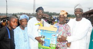Osun Legislator Identifies How Poverty Can Be Alleviated Chairman Osun House of Assembly Committee on Information and Strategy, Honourable Olatunbosun Oyintiloye (3rd right); Owalare of Ilare-Ijesa, Oba Emmanuel Otebolaku (2nd right) presenting a plasma television with DSTV decoder to the Chairman, Iketewi Youths Forum, Sule Raimi, during Oyintiloye's ward to ward Empowerment programme for farmers, widows and others, at Ilare Ward 10 of Obokun East Local Council Development Area (LCDA) of Osun…during the week…