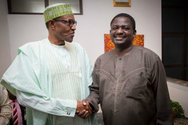 Femi Adesina, right, with his boss, President Muhammadu Buhari...