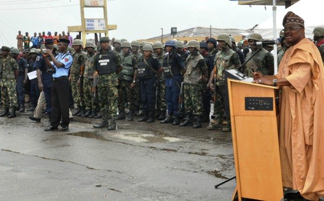 Governor Abiola Ajimobi, right, addressing security operatives...