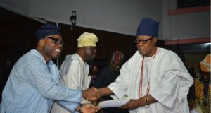 Despite Olubadan’s Resistance, Oyo Government Gives Certificates To 21 Obas, Coronation Holds On Sunday Oba Lekan Balogun, right, receives his certificate from the representative of the Government of Oyo State, Mr Olalekan Alli, the SSG...