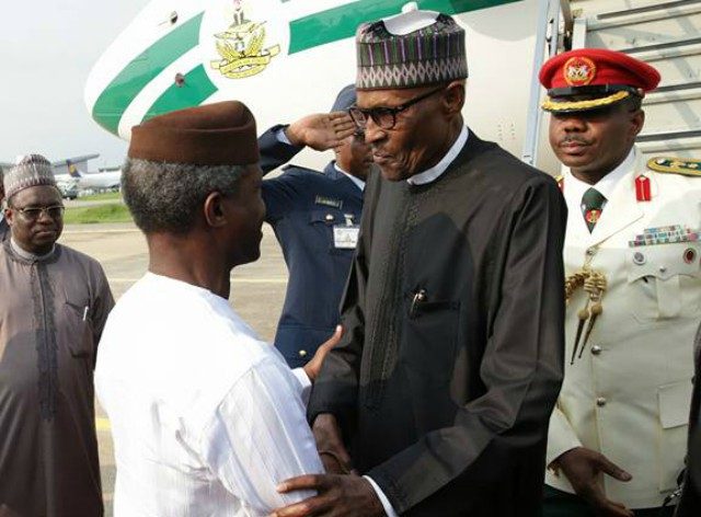 President Muhammadu Buhari, right, with Vice President Yemi Osinbajo...when the President arrived on Saturday...