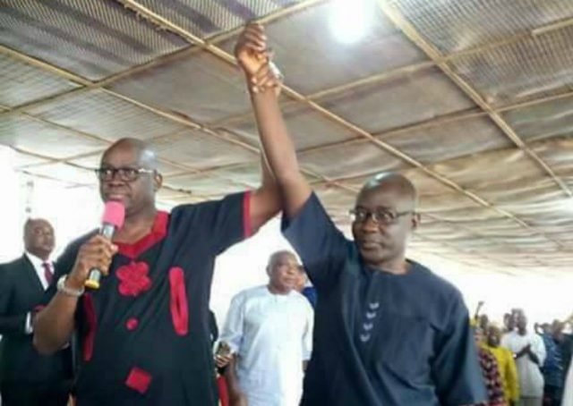 Ekiti's Governor Ayodele Fayose, left, endorses Professor Kolapo Olusola as 'sole' candidate for PDP...