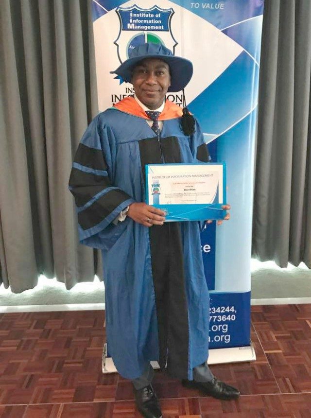 Dr Dayo Olomu...displays his newest certificate....