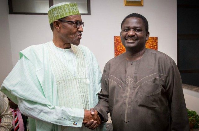 President Muhammadu Buhari, left, with Femi Adesina...congratulating one another for a job well done?