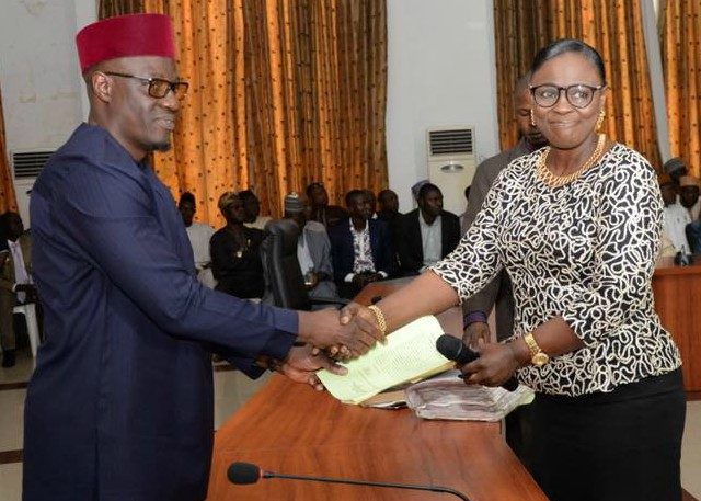 ...the new Head of Service, Mrs Susan Modupe Oluwole, right, being congratulated by Governor Abdulfatah Ahmed...