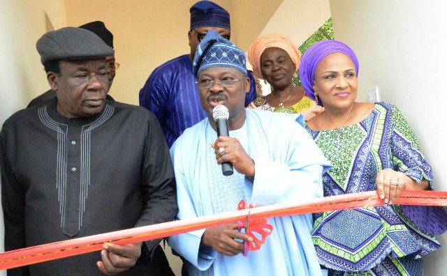 L-R: Oyo State Deputy Governor, Chief Moses Adeyemo; the Governor, Senator Abiola Ajimobi; and his wife, Florence, during the inauguration of OYSOWA House on Monday…