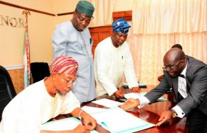 Environment: Osun Signs $450m With American Company From the left: Governor State of Osun, Ogbeni Rauf Aregbesola, Commissioner for Environment and Sanitation, Hon. Idowu Korede, Senior Special Adviser On Osun Weste Management Agency, Alhaji Ganiyu Oyeladun, and Acting Solicitor General, Adedapo Adeniji, during the Signing of the Memorandum of Understanding (MoU)