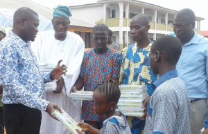 Over 2,000 Students Benefit From Hon. Ige’s Educational Empowerment Programme Hon Akeem Ademola Ige gives out notebooks to students during the programme...
