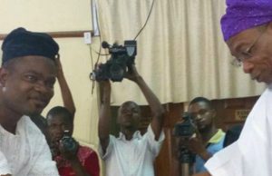 Aregbesola Charges New Members Of Osun Judicial Service Commission Governor Rauf Aregbesola, right, congratulating one of the members of the Commission, Hon Olarotimi Makinde...
