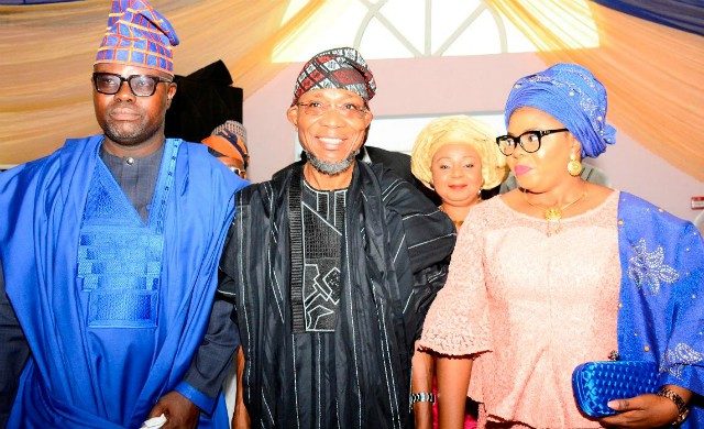 Governor Rauf Aregbesola, middle, with Mr and Mrs Semiu Okanlawon at the birthday carnival...