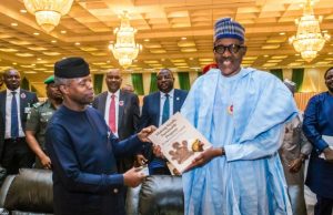 Photos: Buhari, Others Attend Book Launch By Media Unit Of The State House President Muhammadu Buhari, right, receives a copy of the book from Vice President Yemi Osinbajo...