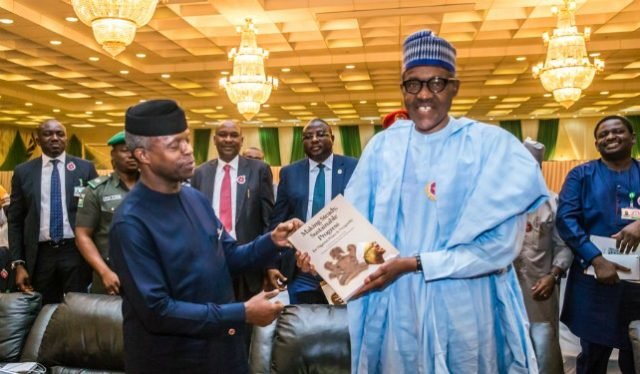 President Muhammadu Buhari, right, receives a copy of the book from Vice President Yemi Osinbajo...