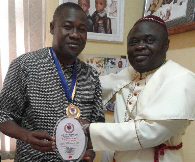 Bishop of Ogbomosho Diocese Reverend (Dr) David Ademola Moradeyo, right, presenting the award of excellence to Hon. Ademola Akeem Ige as the Faithful of God on behalf of Methodist Church, Nigeria Diocese of Ogbomosho. The award was in recognition and appreciation of dedication to the Service of God and humanity…