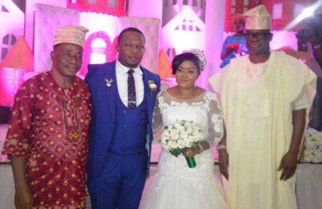 R-L: Governor Ayodele Fayose, the couple and the groom's father, Hon Kola Oluwawole...during the wedding ceremony...