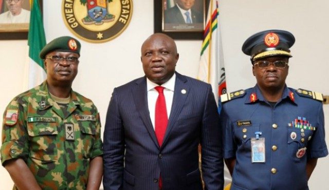 Governor Akinwunmi Ambode, middle, with top military officers after the meeting...
