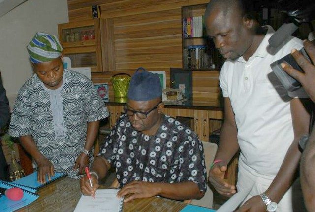 Governor Ayodele Fayose of Ekiti State...signs the new law...