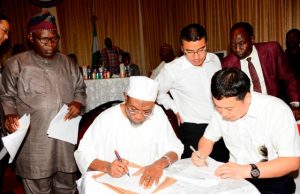 Chinese Firm, Osun Partner To Float N216b Industrial Park Governor of Osun, Ogbeni Rauf Aregbesola (2nd left), General Manager Jiangsu Wuxi Taihu Cocoa Food Company Limited, Liu Jianhui (right), Interpreter, Yan Kai (3rd right), Comissioner for Commerce, Industries and Cooperatives, Mr Ismaila Jayeoba Alagbada (left) and Coordinating Director, Ministry of Commerce, Industries and Cooperatives, Mr. Abimbola Osho, during the signing of agreement…