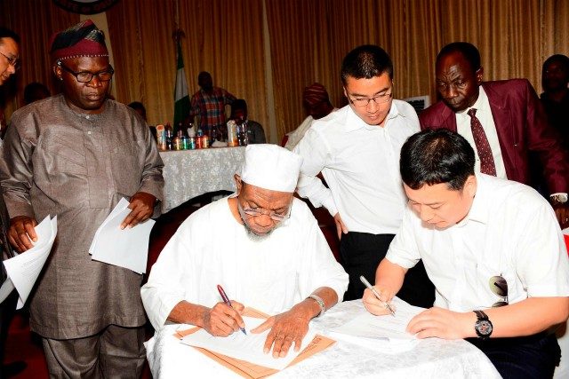Governor of Osun, Ogbeni Rauf Aregbesola (2nd left), General Manager Jiangsu Wuxi Taihu Cocoa Food Company Limited, Liu Jianhui (right), Interpreter, Yan Kai (3rd right), Comissioner for Commerce, Industries and Cooperatives, Mr Ismaila Jayeoba Alagbada (left) and Coordinating Director, Ministry of Commerce, Industries and Cooperatives, Mr. Abimbola Osho, during the signing of agreement…