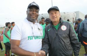 Go For Victory Against Algeria -TGI Group Charges Eagles Eagles' Gernot Rohr, right, with the representative of TGI...